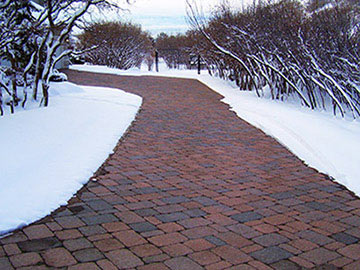 Radiant heated driveway with brick pavers.