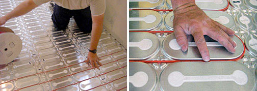 Installing HeatShield floor heating insulation panels and heat cable.